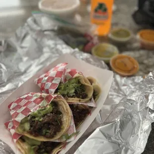 two tacos on tin foil