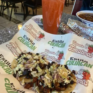 two al pastor tacos and strawberry lemonade