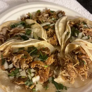 a plate of tacos on a table