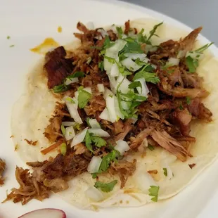 Carnitas taco on flour tortilla