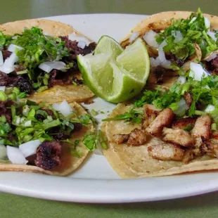 three tacoss on a plate