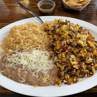 Breakfast plate #1 (eggs, chorizo and potatoes) tortilla on the side. Amazing.