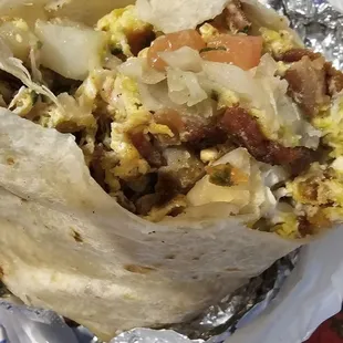 included two photos. One of how they usually make them and the one they shorted me on showing it's half tortilla.