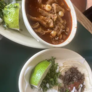 Menudo and barbacoa taco on corn
