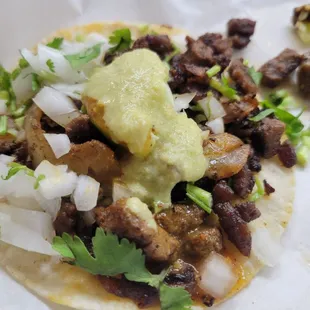 Al pastor, pictured and Carne asada were very good authentic tacos.