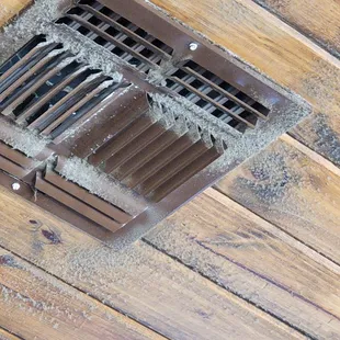 a vent in a wood floor