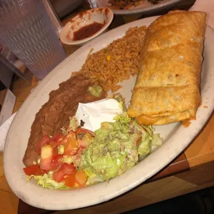 #33 Enchilada, Nachos in the background. Homemade salsa