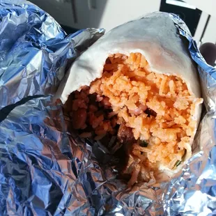 Carne asada burrito thats 80% rice, 10% beans, 6% meat, 4% onion and cilantro.  $7, soo not worth it. Meat was dry and salty