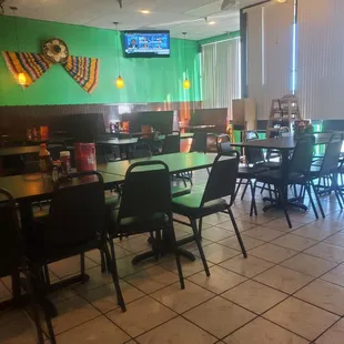  tables and chairs in a restaurant