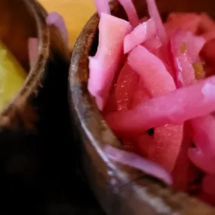 two bowls of pickled onions