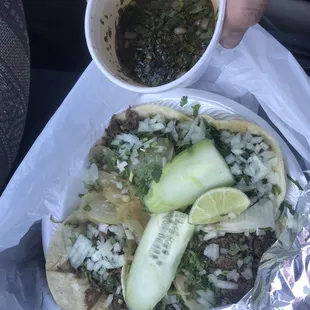 Birria Tacos with Consome (broth/soup) on the side.