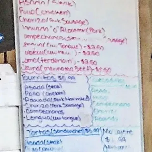 a whiteboard with a list of food items on it