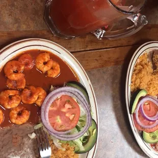 Camarones a la diabla, VERY SPICY but rice and beans were good lol.