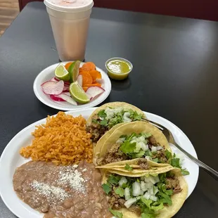 Taco (carne asada) combo plate. Agua Frescas (cantaloupe melon).