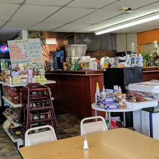 Counter, kitchen, and drink coolers.