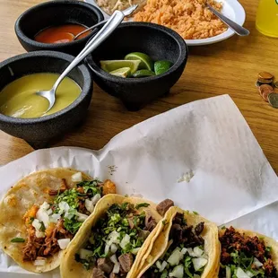 a plate of tacos and salsa