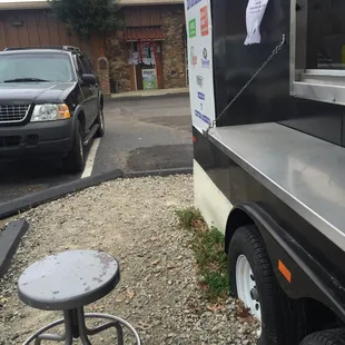 The seats next to the food truck