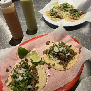 Steak tacos, carnitas tacos.