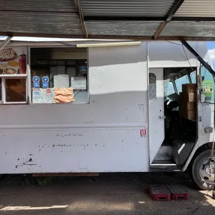 a taqueria truck parked in a parking lot