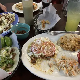 Carnitas taco (fresh made tortilla and crispy pork), sope with chorizo, pupusa revuelta, pineapple agua fresca