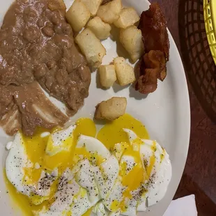 2 eggs over easy, beans, very tasty taters and bacon. Could use another strip or 2 of bacon, but it was cooked perfectly.