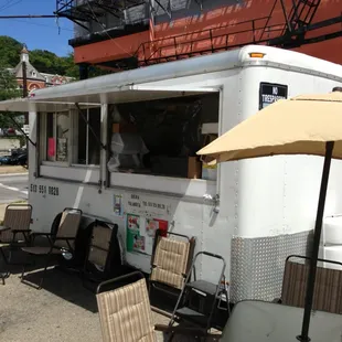 a food truck parked on the side of the road