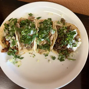 4 tacos de adobada, carnitas ,pollo &amp; asada ! (Left to right)