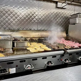 a grill with food cooking on it