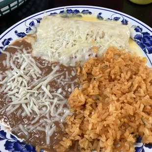 Rice, beans, enchiladas chicken I think?