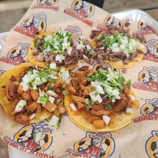 Carnitas taco, carne asada taco, and 2 al pastor tacos.
