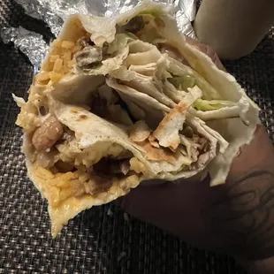 A Burrito with just tortilla folded in a way to create an illusion that it&apos;s full