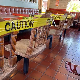 a caution sign on a bench