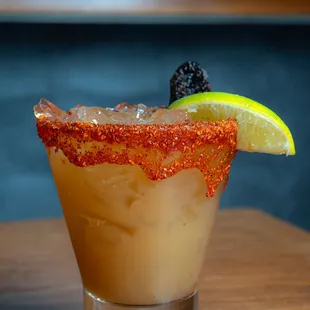 a closeup of a margarita with a slice of lime