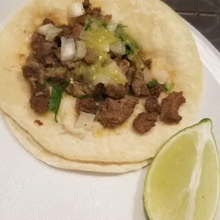Carne asada taco. Has good flavor but not enough meat for $1.75.