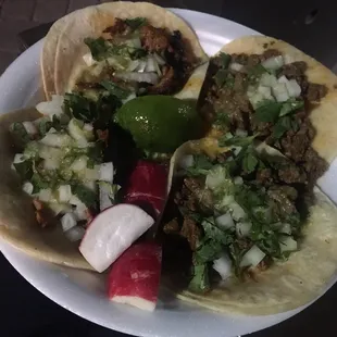 Carne and al pastor tacos.   $1.85 each