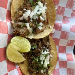 Carnitas and carne asada taco