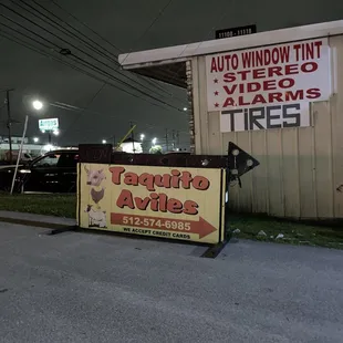 Sign at the entrance, the business is located further back in the lot.