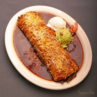 Burrito Chipotle with your choice of meat, scoop of sour cream and guacamole.