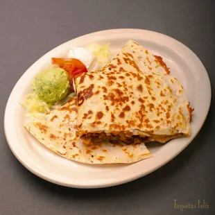 Quesadilla with your choice of meat, a scoop of sour cream and guacamole.