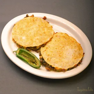 Mulitas - Corn Tortillas stuffed with cheese and your choice of meat.