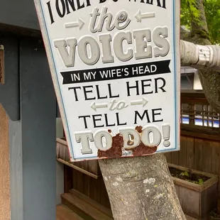 a sign on a tree