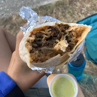 Carne asada burrito with green salsa