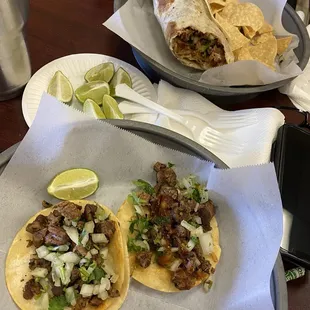 2 Carne Asada Tacos and 1 Carne Asada burrito with everything. Delicious!