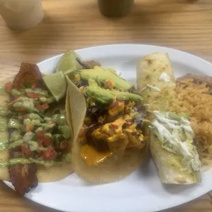 Left to right: pork belly taco, grouper taco, chicken enchilada, refried beans and rice.