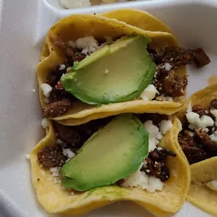 Two of the tripe mini-tacos. Check out the avocado slices.