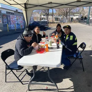 a group of people sitting at a table