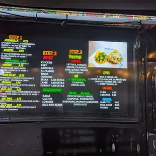 a menu on a food truck