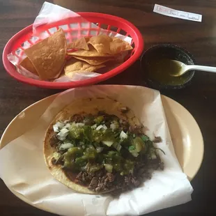 Fajita taco with cebolla/cilantro y limon. The chips are made in house too!