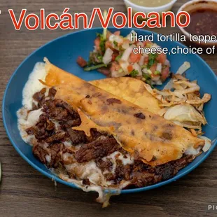 a plate of tacos and salsa