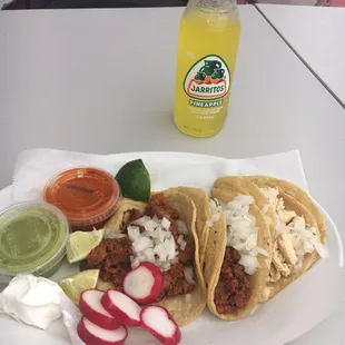 a plate of tacos and salsa